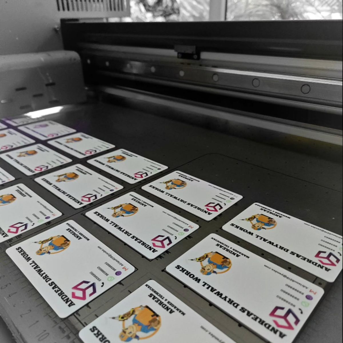 A close-up, professional image showing a custom ID card being scanned at a modern access control reader. The ID card features a clear photo, company logo (Same Day ID), and a name. The background is slightly blurred but suggests a secure, contemporary off