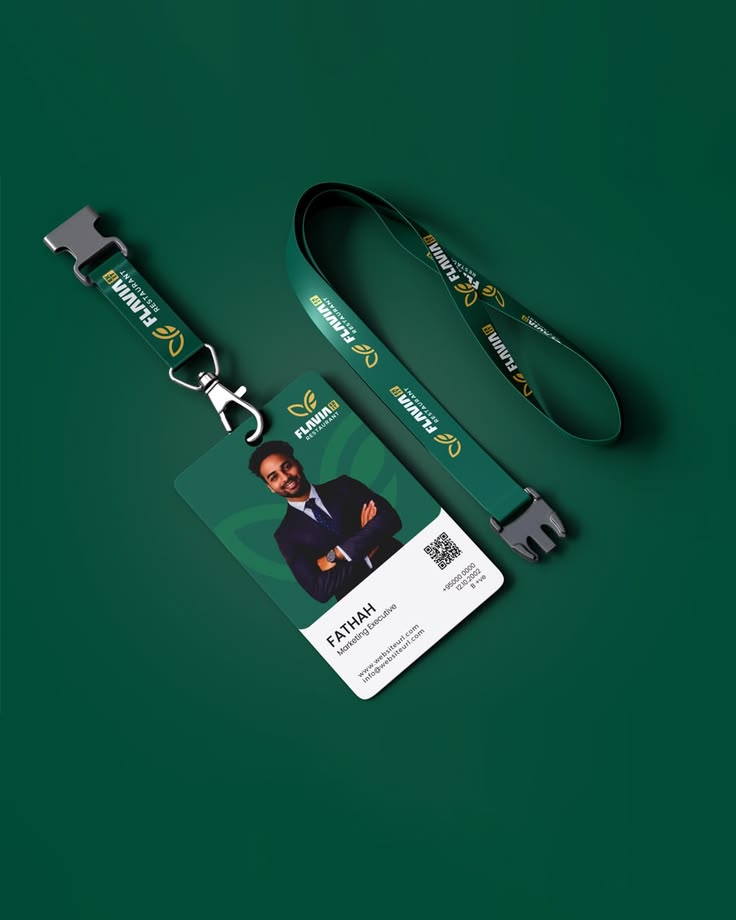 A diverse group of business professionals holding up their custom ID cards, smiling, in a modern, well-lit office environment. In the foreground, a stack of freshly printed, branded ID cards sits on a desk next to a professional card printer, suggesting e